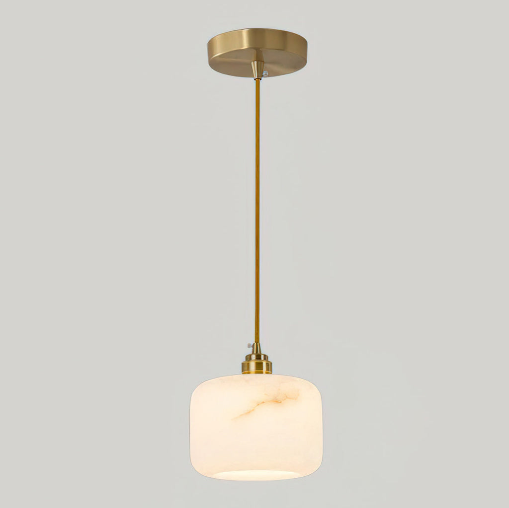 Single Clérachic alabaster pendant on a short brass rod, with a round brass ceiling canopy against a pale grey wall.