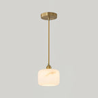 A single Clérachic alabaster pendant, brass rod and canopy, at the larger size on a plain light grey backdrop.