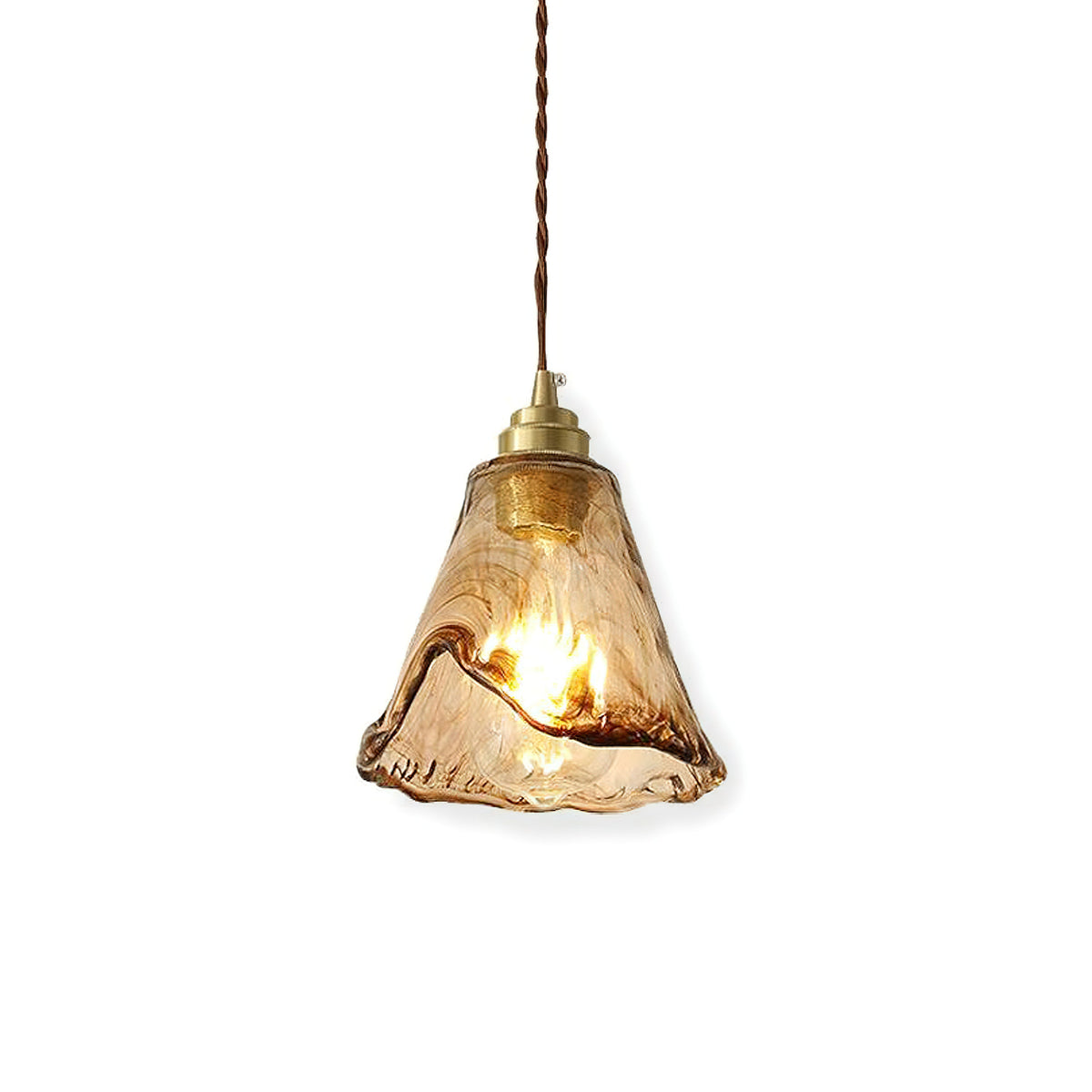 A Clérachic pendant with a flared amber glass shade and a rippled hem, on a white backdrop, with a bulb lit inside.
