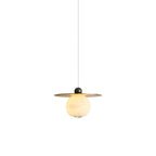 Clérachic Brass and Alabaster Globe Cord Pendant Light shown against white, the globe tucked under its flat brass plate.