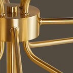 Detail of the brushed brass central hub where the arms of this Clérachic chandelier join the stem.