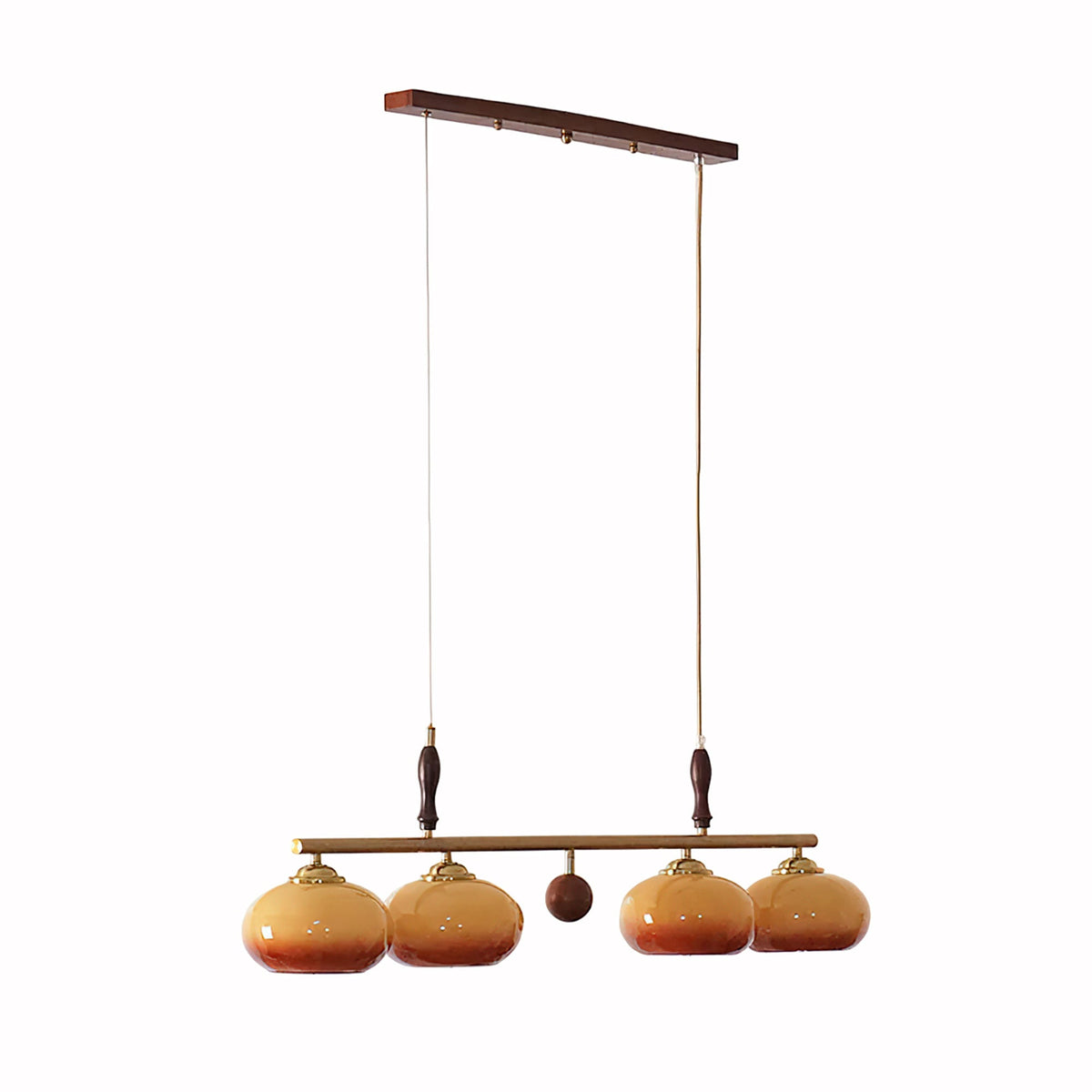 Four-head version of this Clérachic pendant on a white backdrop, with a wooden ceiling bar, a small wooden ball at the centre and amber shades.