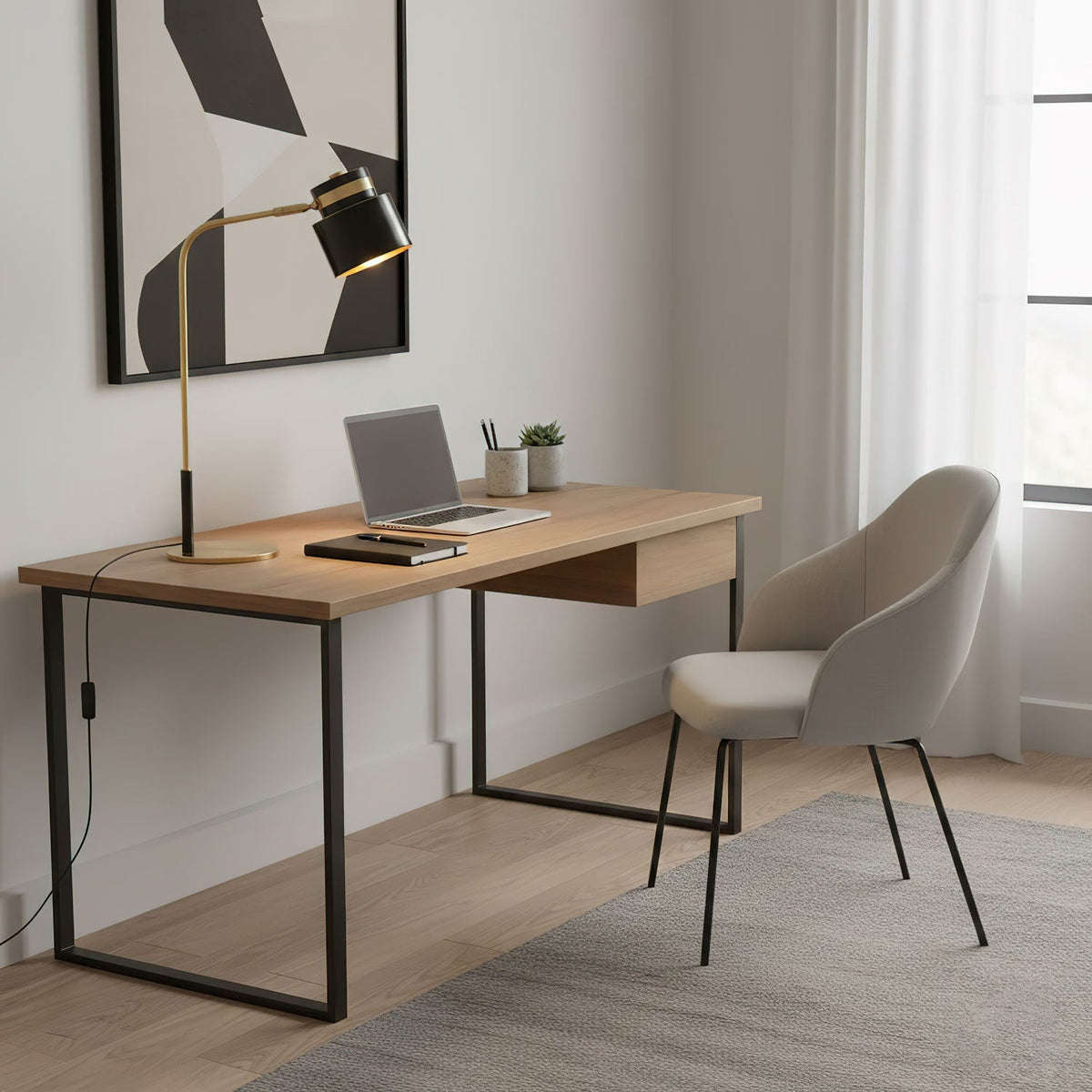 The Clérachic lamp arches over a pale wood desk with a laptop, black steel legs and a soft grey chair by the window.