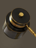 Close view from above of the stacked shade, brass ring and round brass cap on this Clérachic table lamp.
