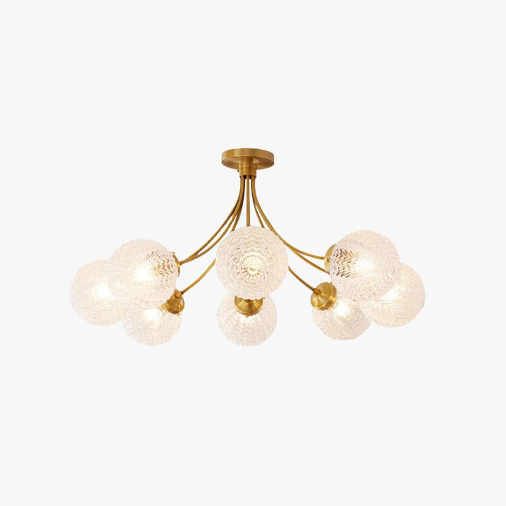 Brass semi-flush ceiling light with rippled glass globes on curved arms, lit warm, on a plain white backdrop, from Clérachic.