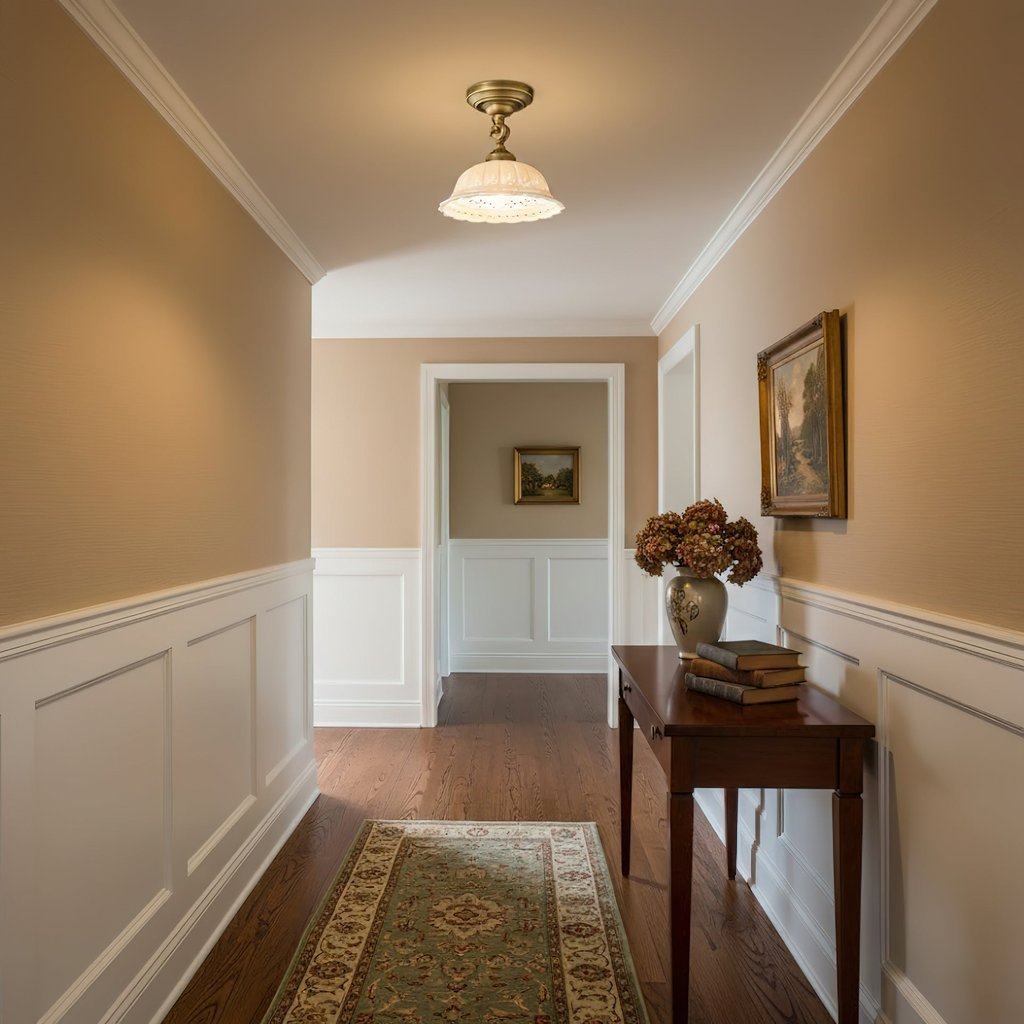 Clérachic ceramic dome light hanging in a long hallway with warm beige walls, white panelling, a runner rug and a wooden console.