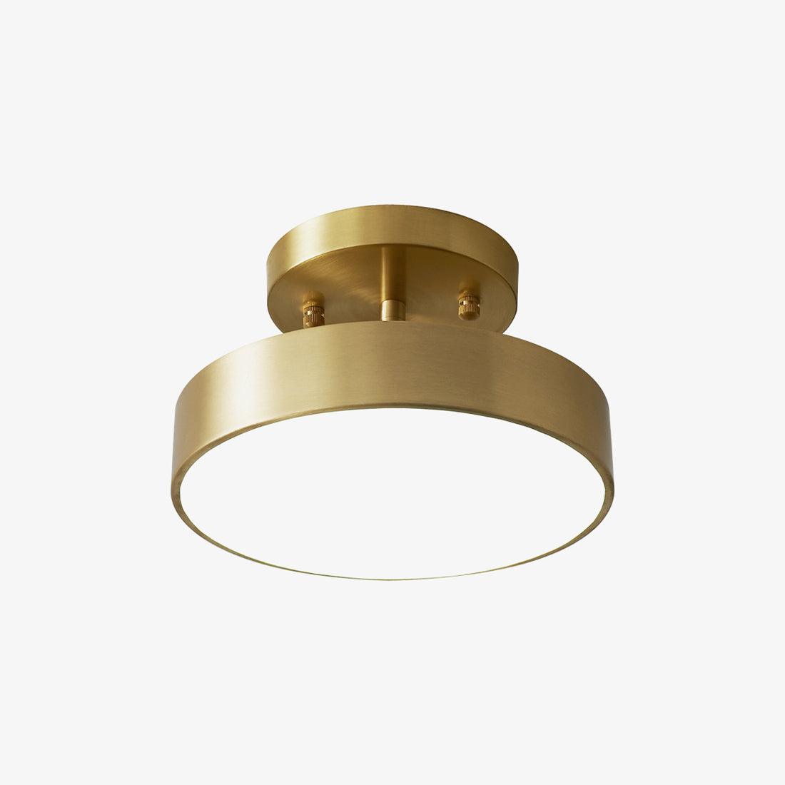 Front view of a Clérachic brass ceiling light, showing the round canopy, the brushed metal rim and a pale diffuser, on white.