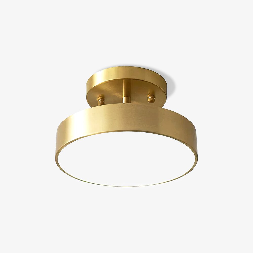 Three-quarter view of the Clérachic brass ceiling light, its brushed rim and pale diffuser below a small round canopy.