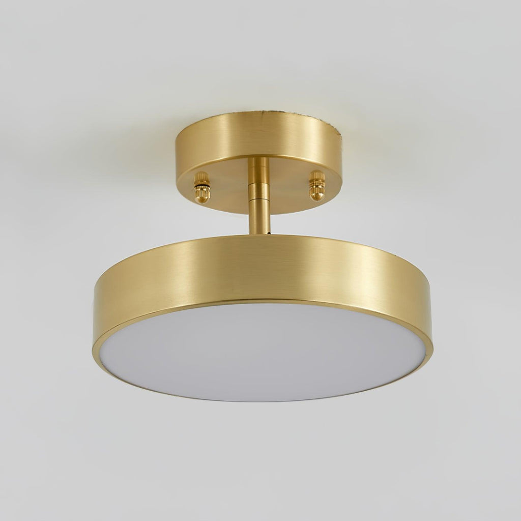 Clérachic brass ceiling light seen from below, with two small screws on the canopy and an unlit pale diffuser under the rim.