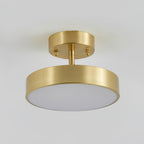 Clérachic brass ceiling light seen from below, with two small screws on the canopy and an unlit pale diffuser under the rim.