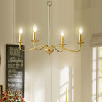 A four-arm Clérachic brass chandelier glows in a sunlit dining room beside a window and a chalkboard sign.