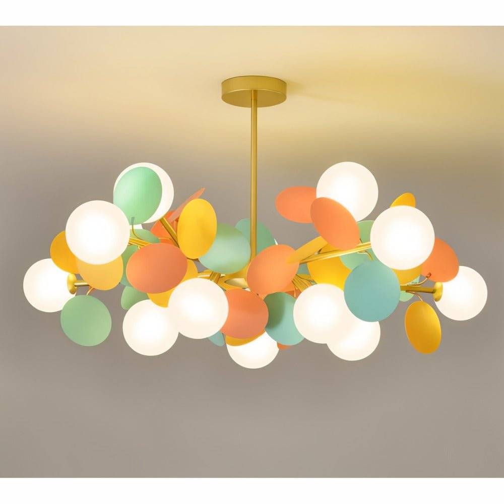 Clérachic wide chandelier of frosted glass globes and mint, orange and yellow metal discs on brass arms.