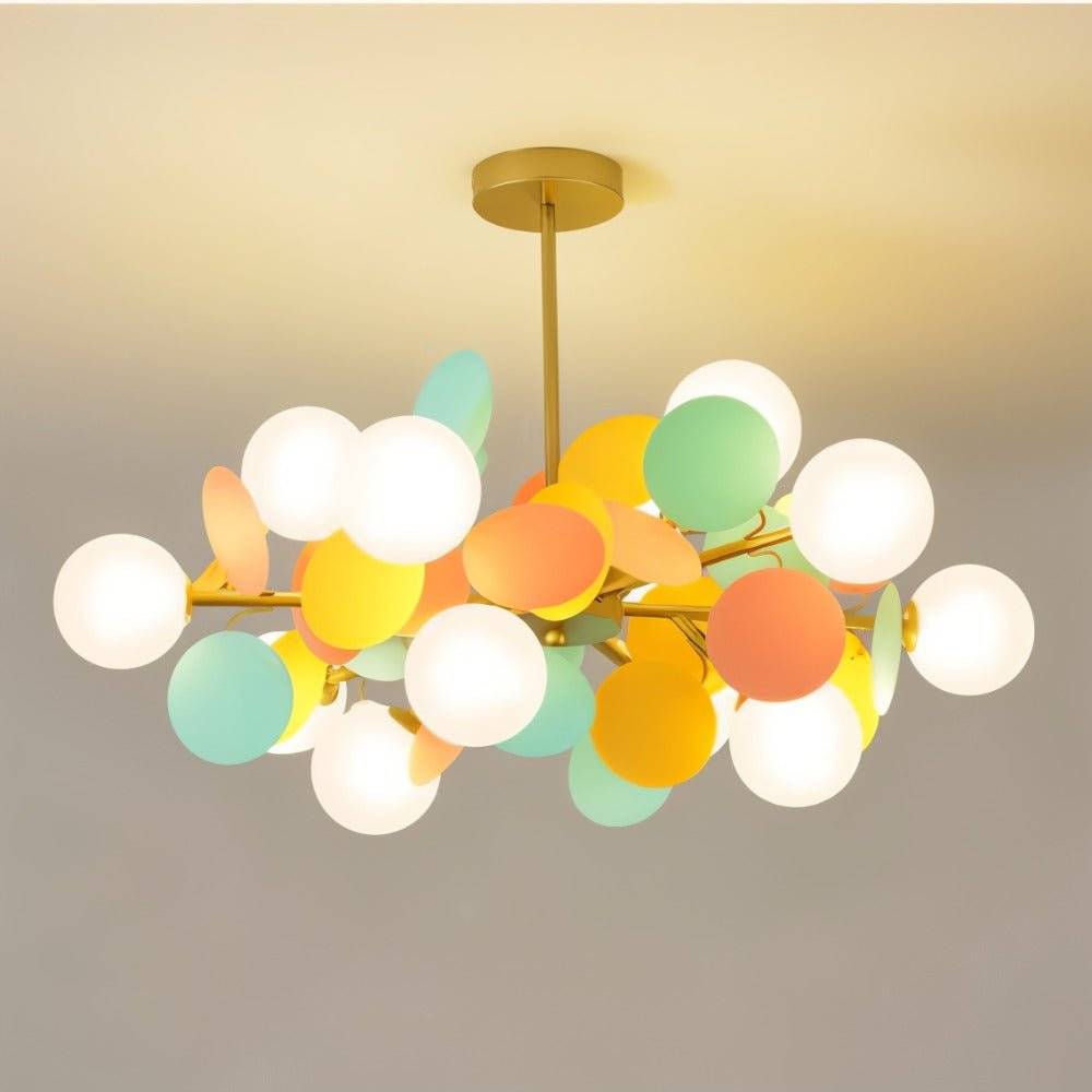 Clérachic branching chandelier with frosted globes and bright mint, orange and yellow discs on a brass rod.