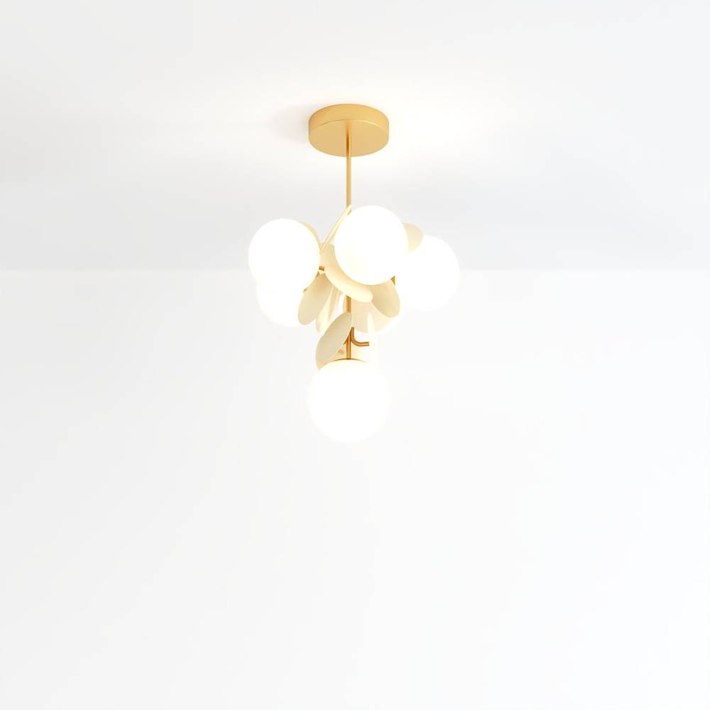 Clérachic tall hanging chandelier of frosted glass globes and cream metal discs on a brass rod and canopy.