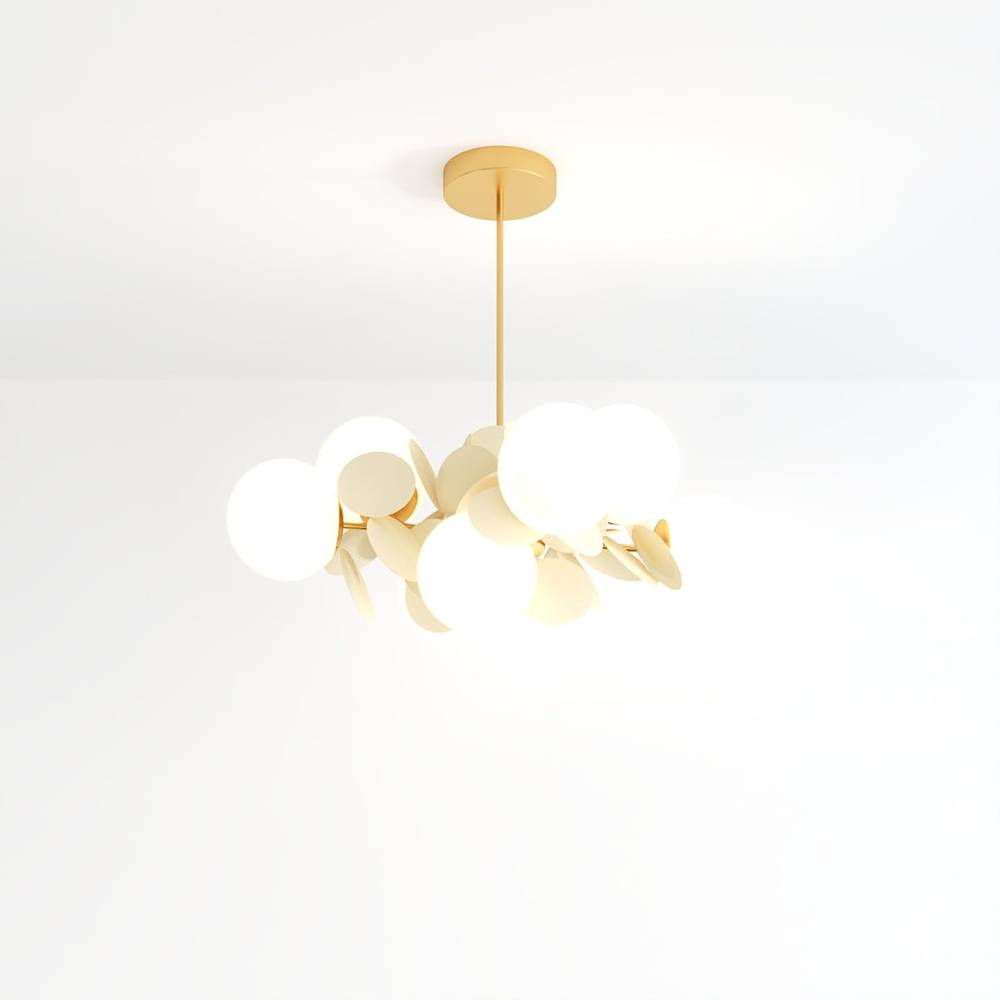 Clérachic chandelier with frosted glass globes and cream metal discs on a brass rod, shot on white.