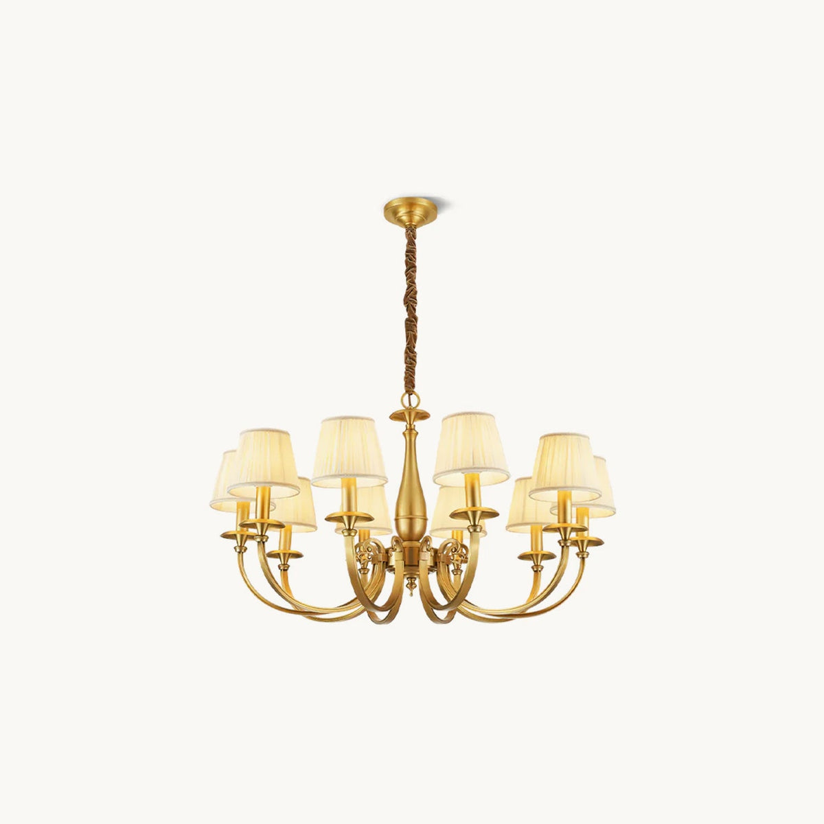 This Clérachic brass chandelier on a plain white backdrop, with curved arms, a slim baluster stem and pleated white fabric shades.