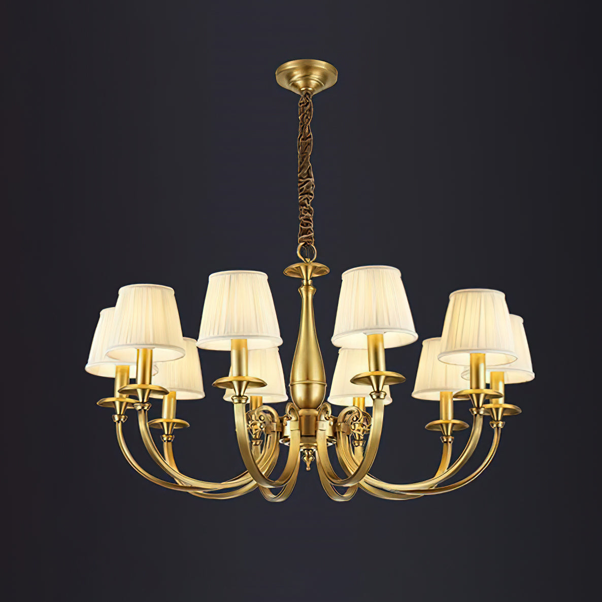 This Clérachic brass chandelier with eight pleated shades hangs on a chain against a dark charcoal backdrop.