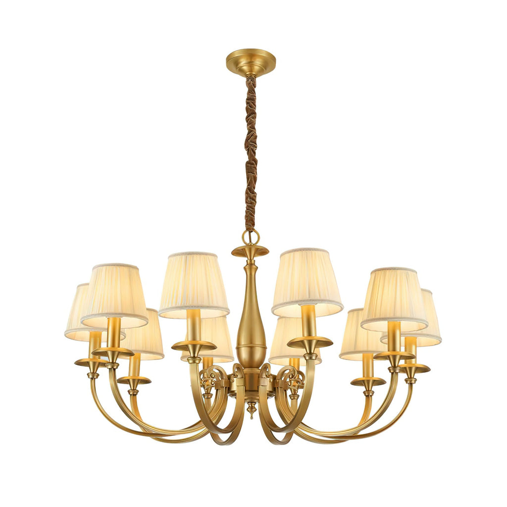 Clérachic brass chandelier with a wide arm spread and pleated white shades, on a white backdrop with a wrapped chain.