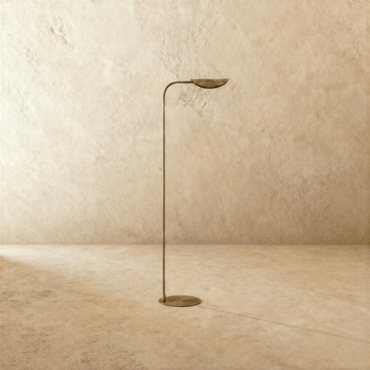 This vintage brass Clérachic floor lamp is shown from another angle, its leaf shade angled toward the ceiling.