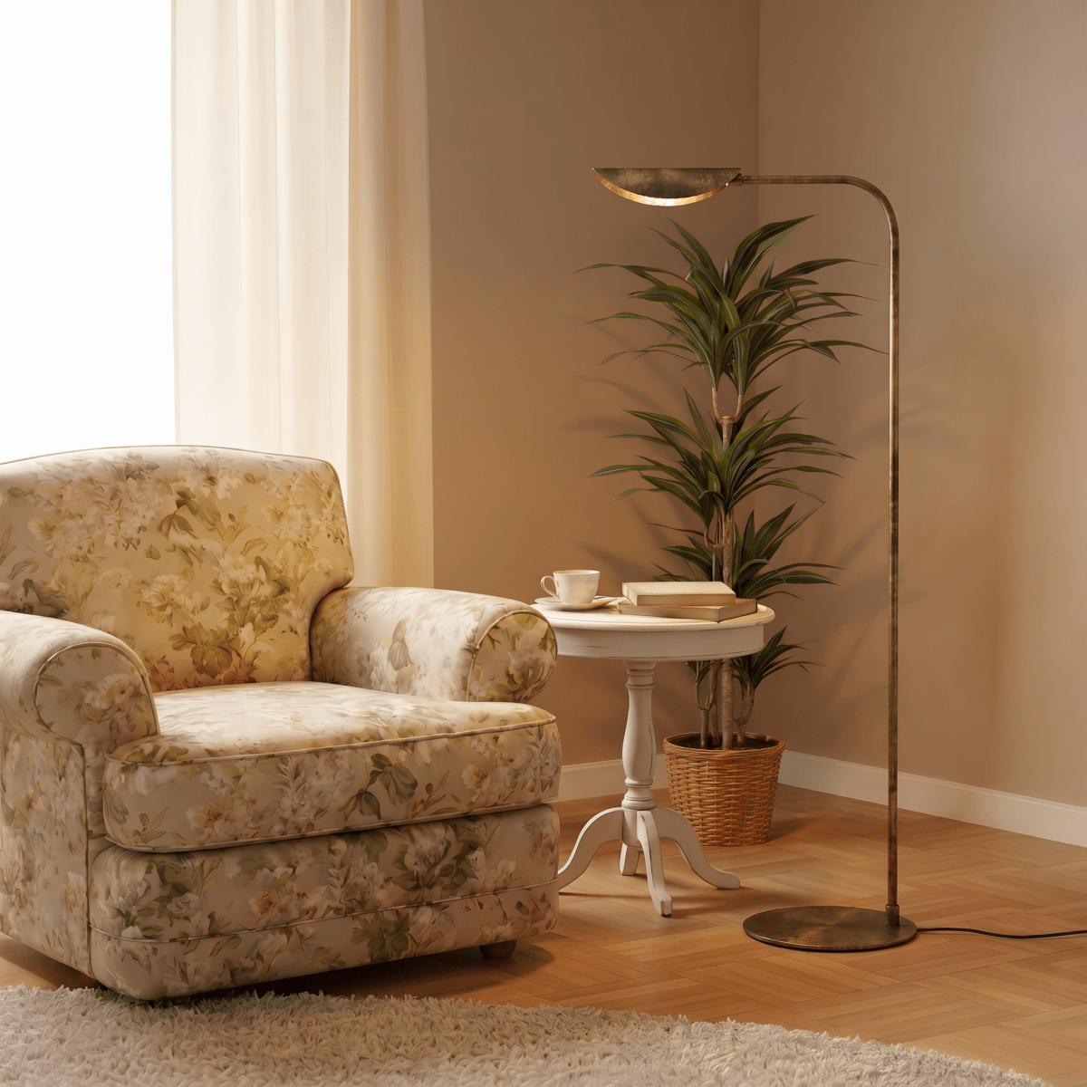 This vintage brass Clérachic floor lamp lights a floral armchair beside a round table set with books.