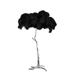 Black plumes on a Clérachic floor lamp with a silver-finish stem and three-footed base, shown on a plain white backdrop.