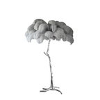 Pale grey plumes on a Clérachic floor lamp with a silver-finish stem and base, photographed on a white backdrop.