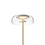 Brass-toned Clérachic table lamp with a clear dome on a white background, with the glass bowl and the inner light ring in close view.