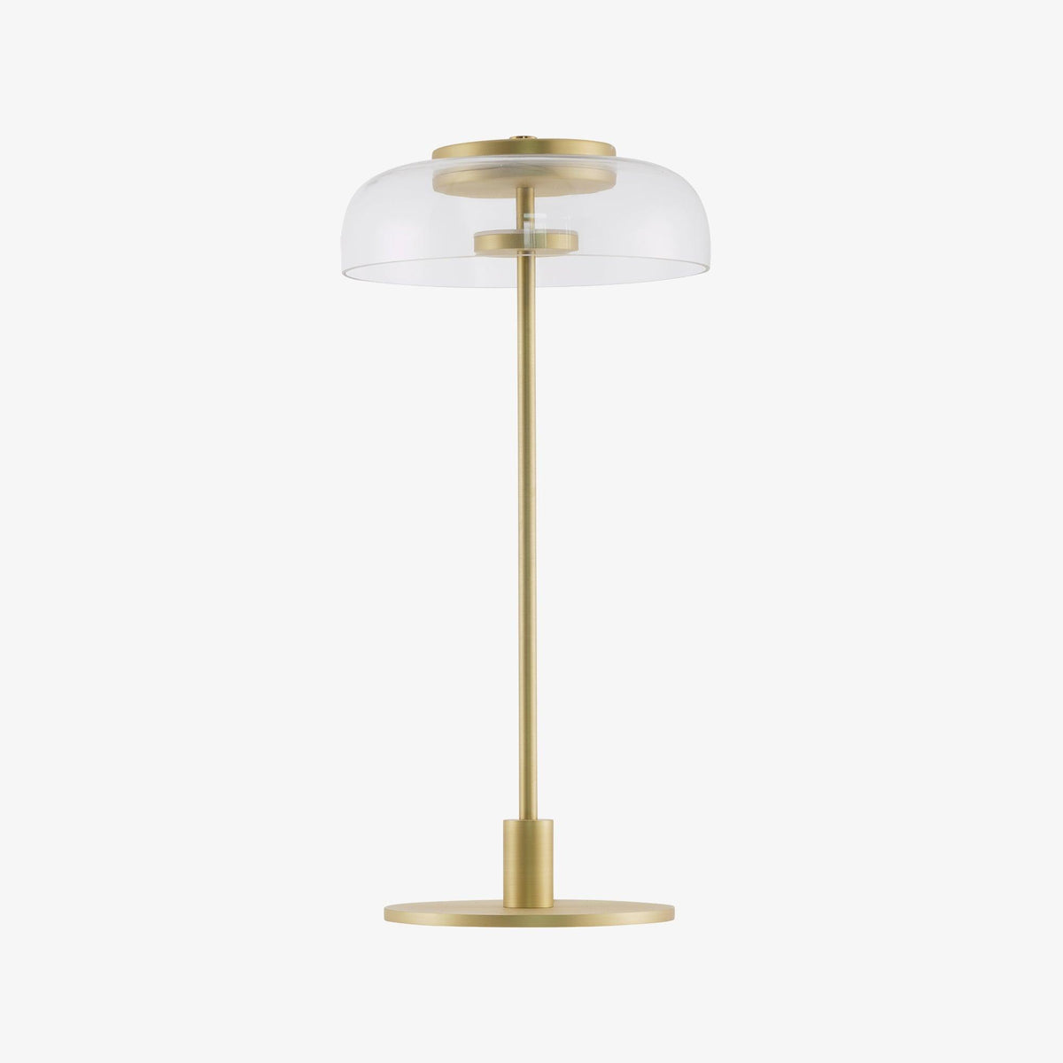 A Clérachic table lamp with a clear dome and a slim stem on a white background, with a flat, round brass-toned base.