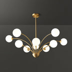 A Clérachic chandelier with eight white globes and a brass rod, seen straight on against a dark grey backdrop.