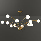 A twelve-globe Clérachic brass chandelier with white glass globes, wide and layered, against a dark grey studio backdrop.