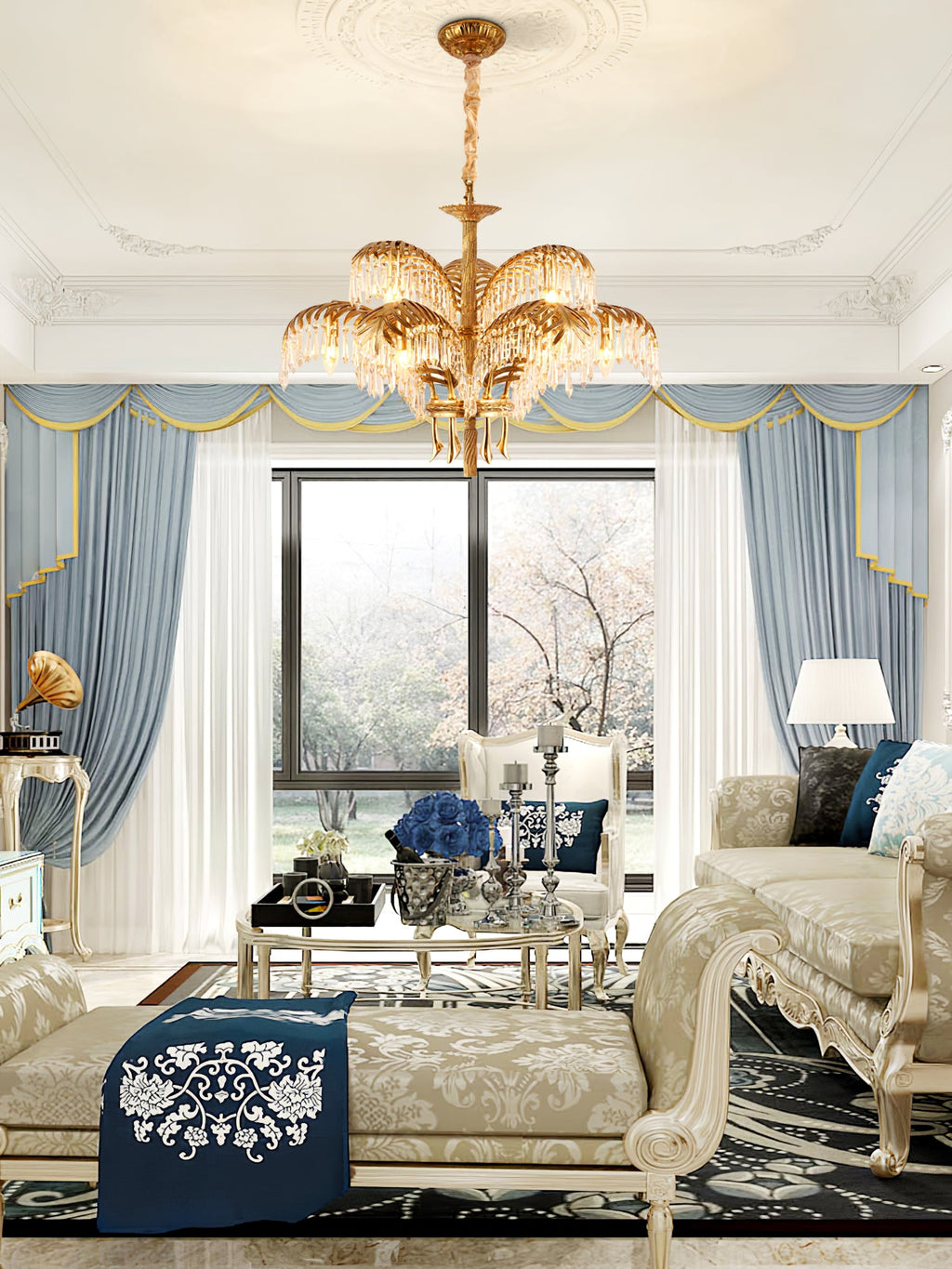 A Clérachic chandelier hangs in a sitting room with blue curtains, a cream daybed and a navy cushion with white embroidery.
