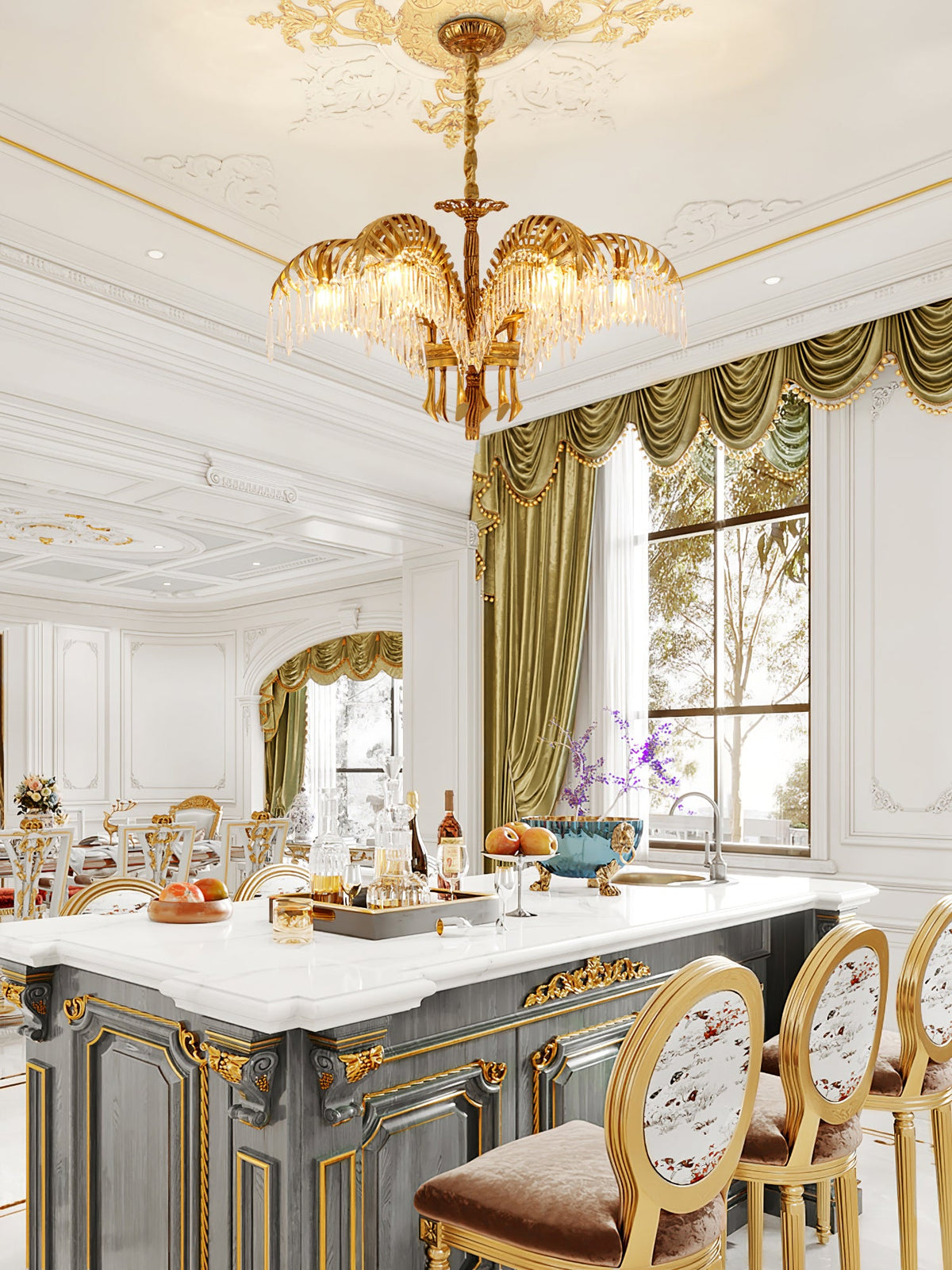 Over a white-topped kitchen island with gilded detail and upholstered stools, a small Clérachic brass chandelier hangs from an ornate ceiling.