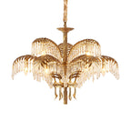 This Clérachic chandelier in gold brass and clear crystal on a white background, showing a woven cord around the upper chain.