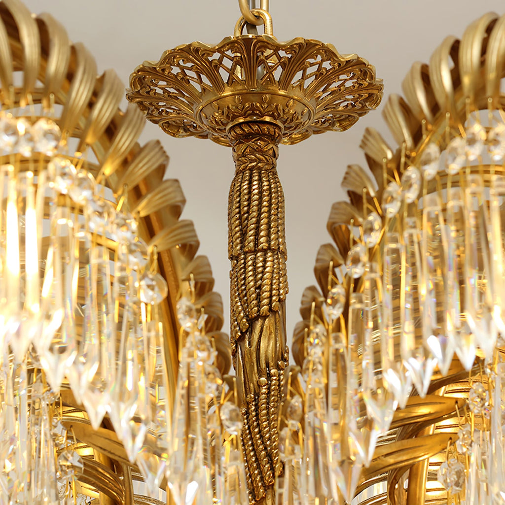 Close view of the pierced brass top cap and the rope-twist stem of this Clérachic chandelier.