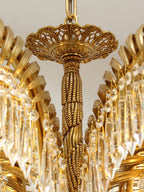 Close view of the pierced brass canopy and twisted rope stem at the top of this Clérachic chandelier.