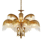 Two tiers of brass leaves with crystal fringes surround a candle-style bulb on this Clérachic chandelier.