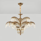 Hung from a bronze ceiling plate with a cord-wrapped chain, this Clérachic chandelier has two tiers of leaves and crystal.