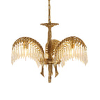 A three-leaf Clérachic chandelier with brass leaves, clear crystal drops and a brass chain, on a white background.