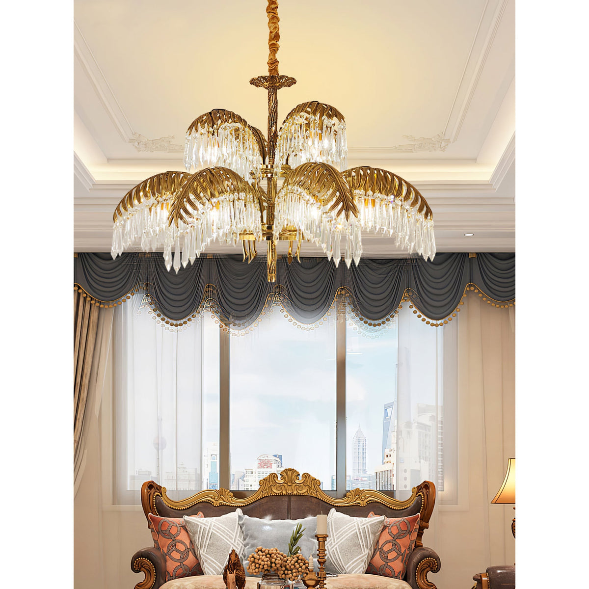 Brass tiers of a Clérachic chandelier with crystal drops hang in front of a tall window, with a gilt sofa below.