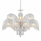 White two-tier Clérachic chandelier with lit candle-style bulbs and a fringe of crystal drops.