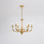 A brass candle-style Clérachic chandelier with six arms and tapered column, seen from slightly below on a pale grey backdrop.
