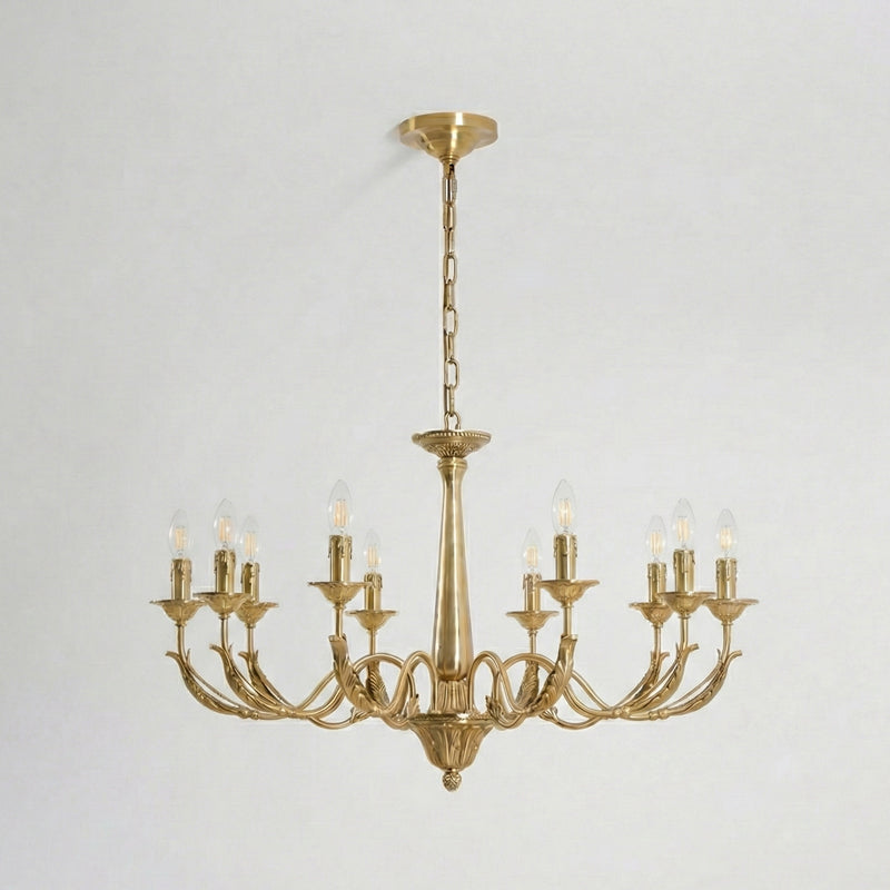 The largest brass candle-style Clérachic chandelier, with ten arms and a long chain, hung against a pale backdrop.
