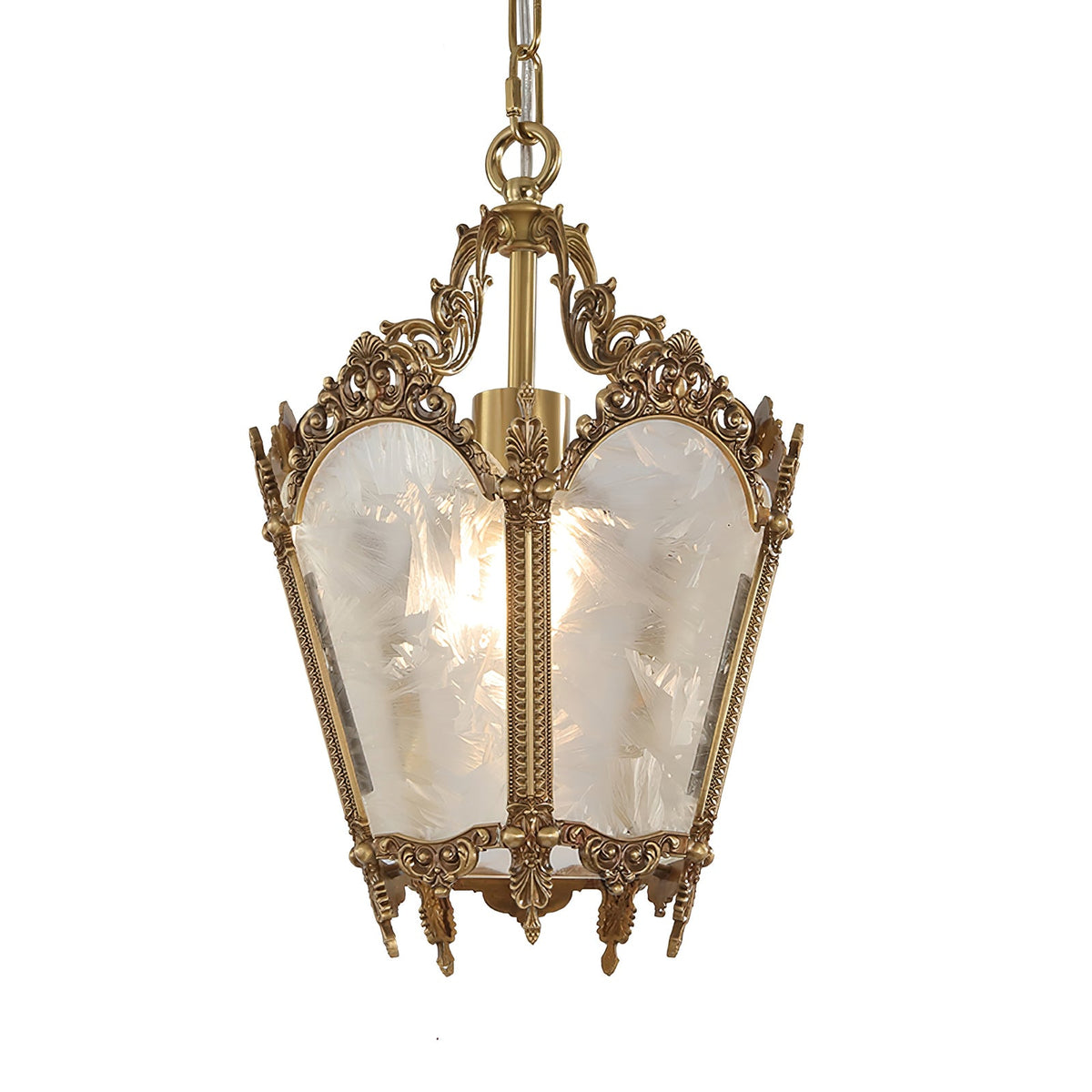 A Clérachic lantern pendant with a lit bulb, frosted glass panels and a carved brass frame, on a plain white backdrop.
