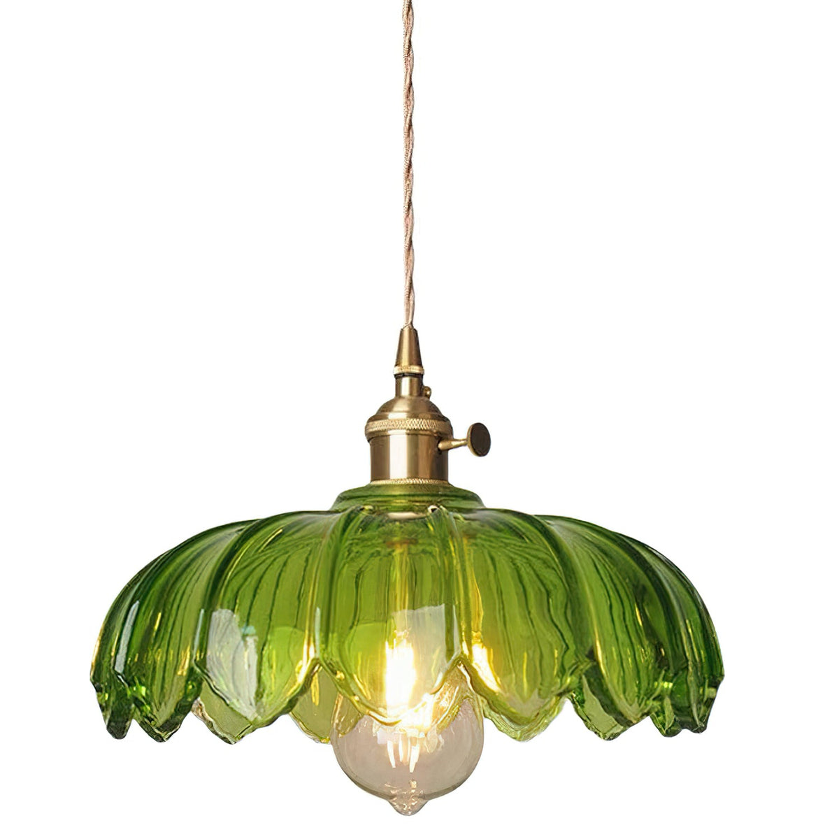 Green glass Clérachic pendant with a petal-edged shade, a brass fitting and a lit bulb, on a plain white backdrop.
