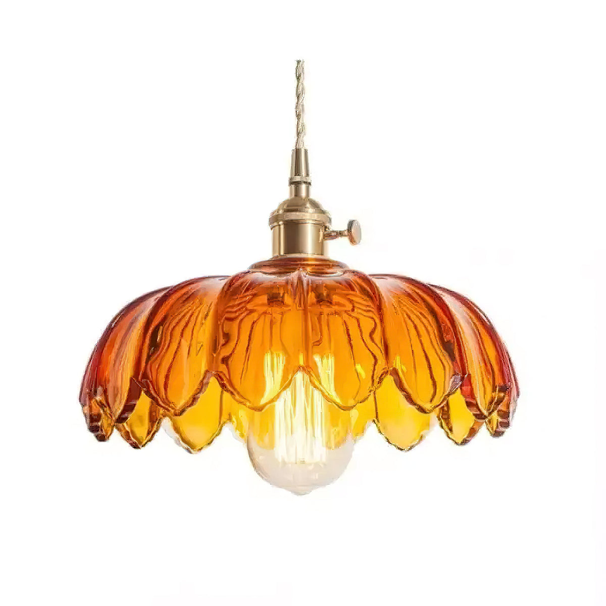 Amber glass Clérachic pendant with a petal-edged shade and a lit bulb below, on a plain white backdrop.