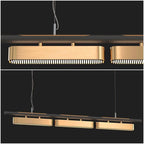 Two views of this Clérachic pendant on a dark backdrop, a close view of the slotted brass diffuser and a wider view of three heads.
