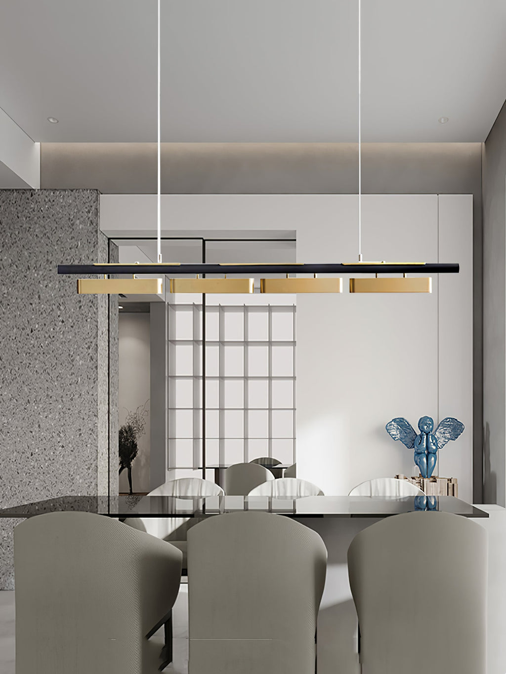 A four-head Clérachic linear pendant in a room with a glass-topped table, grey chairs and a blue sculpture, seen from a distance.