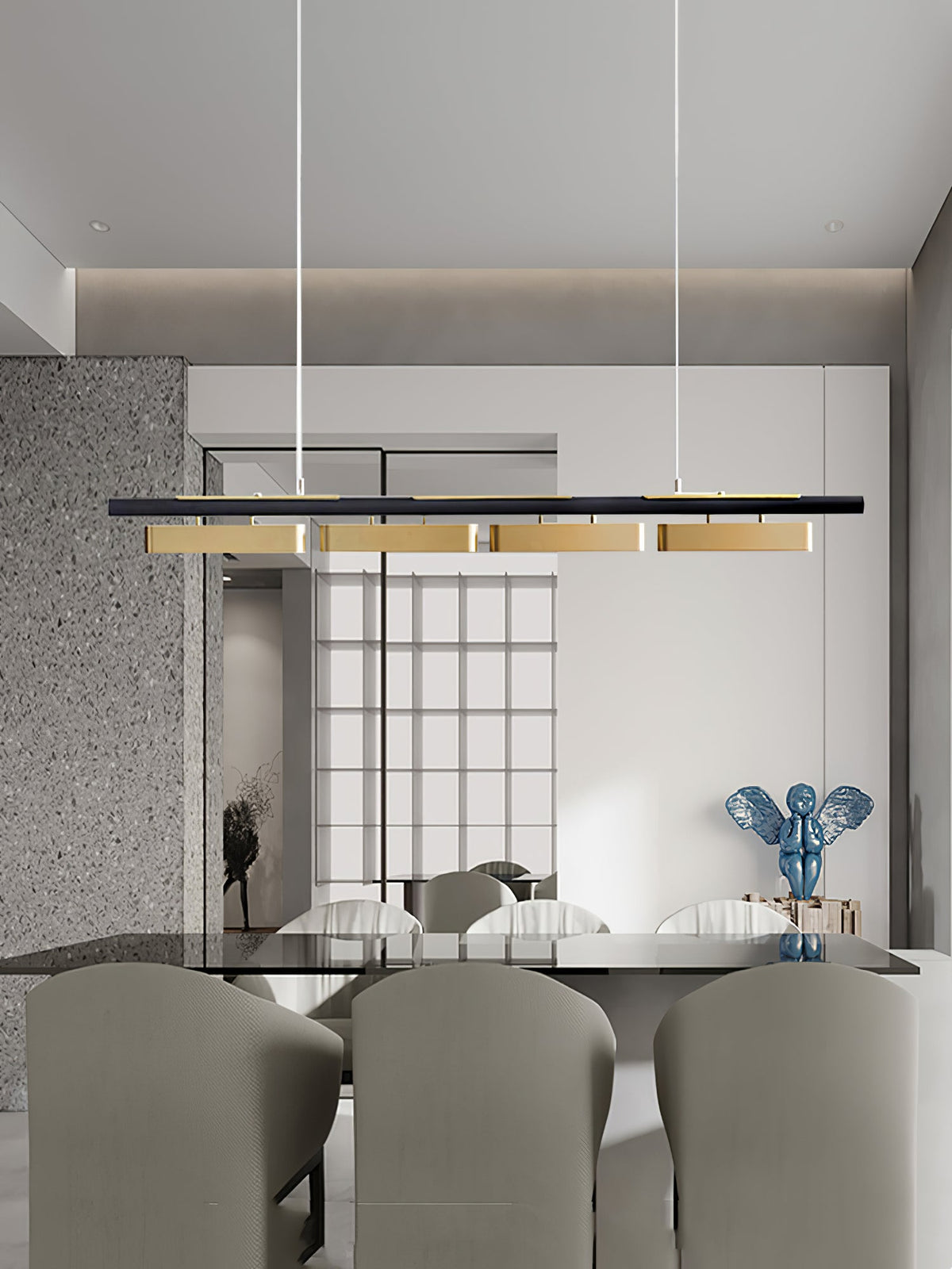 A four-head Clérachic linear pendant in a room with a glass-topped table, grey chairs and a blue sculpture, seen from a distance.