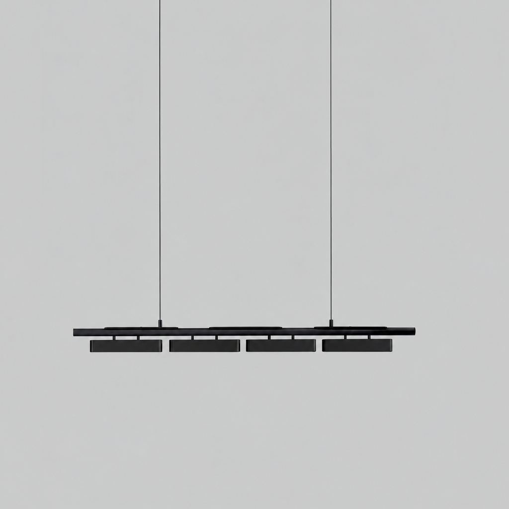 All-black Clérachic linear pendant with four heads, hung on thin wires against a light grey backdrop.