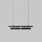 All-black two-head Clérachic linear pendant with larger diffusers, hung against a pale grey backdrop.
